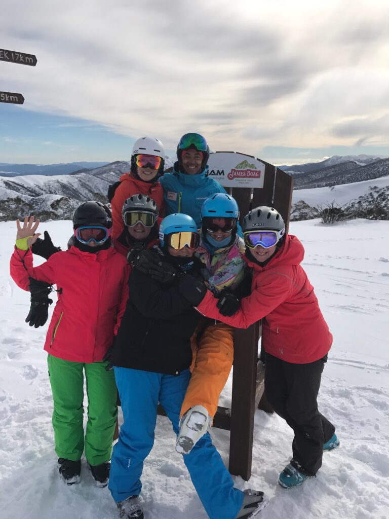 Nathalie celebrating her coaching session with a group of skiers at Mt Hotham Women's Week